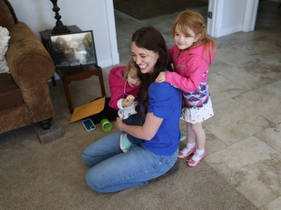 Carolyn Larsen and her kids, in a photo by Jack Orleans of Cronkite News